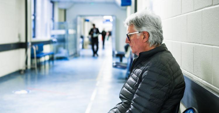 man in hospital corridor 