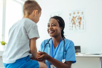 Nurse talking to a young child