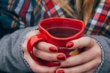 Woman holding mug of coffee