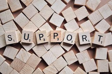 Wooden letters spelling out support