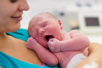 woman holding newborn